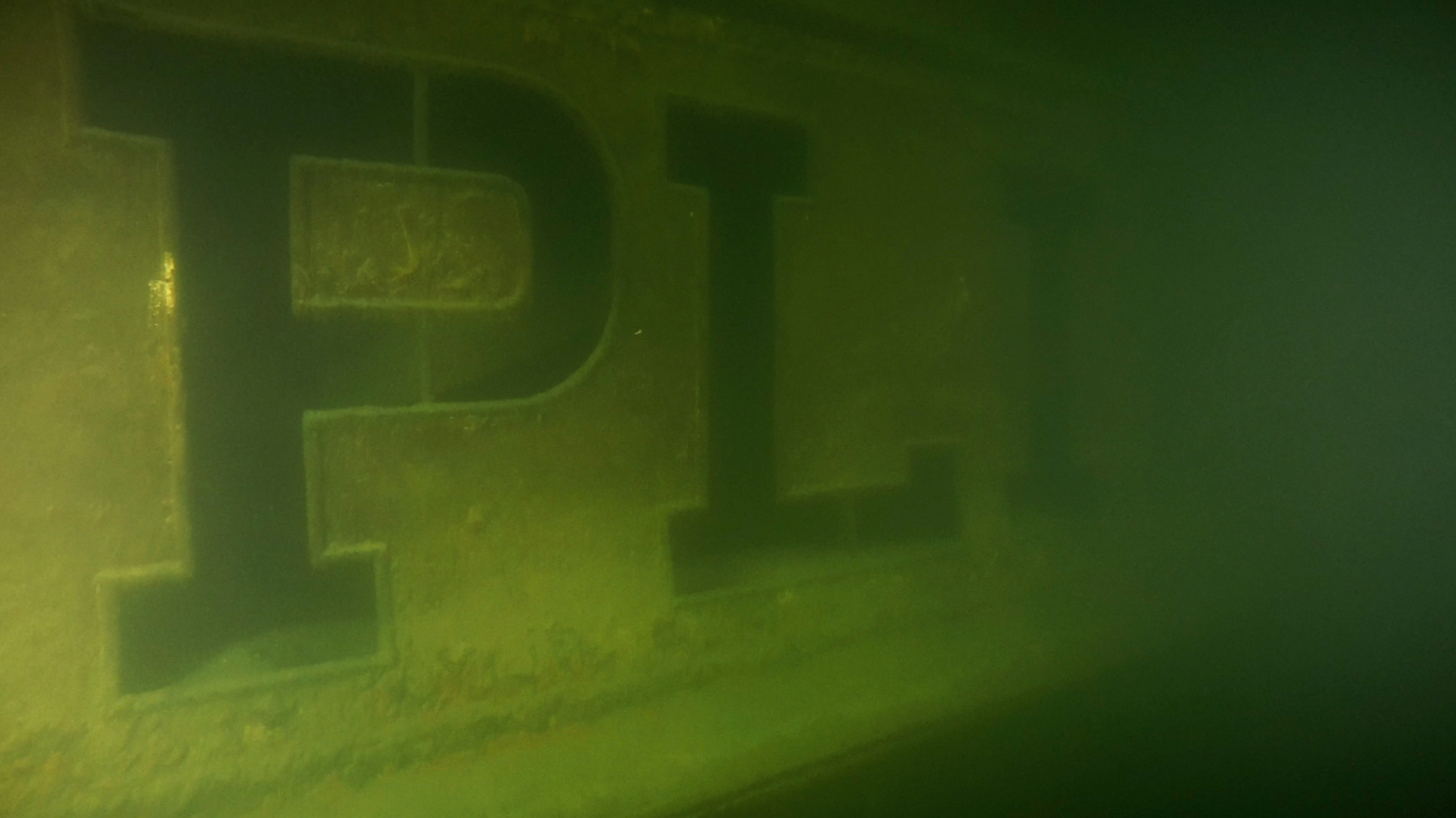 The ship's name “PLINIO” appears in the milky water. Photo by Andrea "Murdock" Alpini