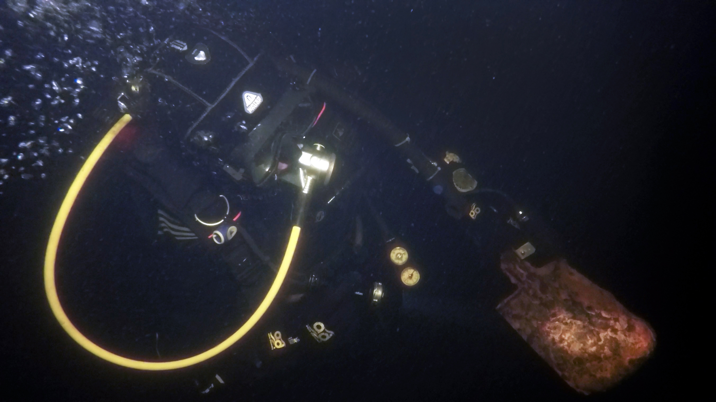 Diver with ammunition found on the barge, Kilpola Island, Lake Ladoga. Photo by Stanislav Trofimov.