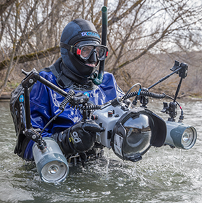 Oleg Shabunya photographs artifacts at the bottom of the river. Photo by Stanislav Trofimov