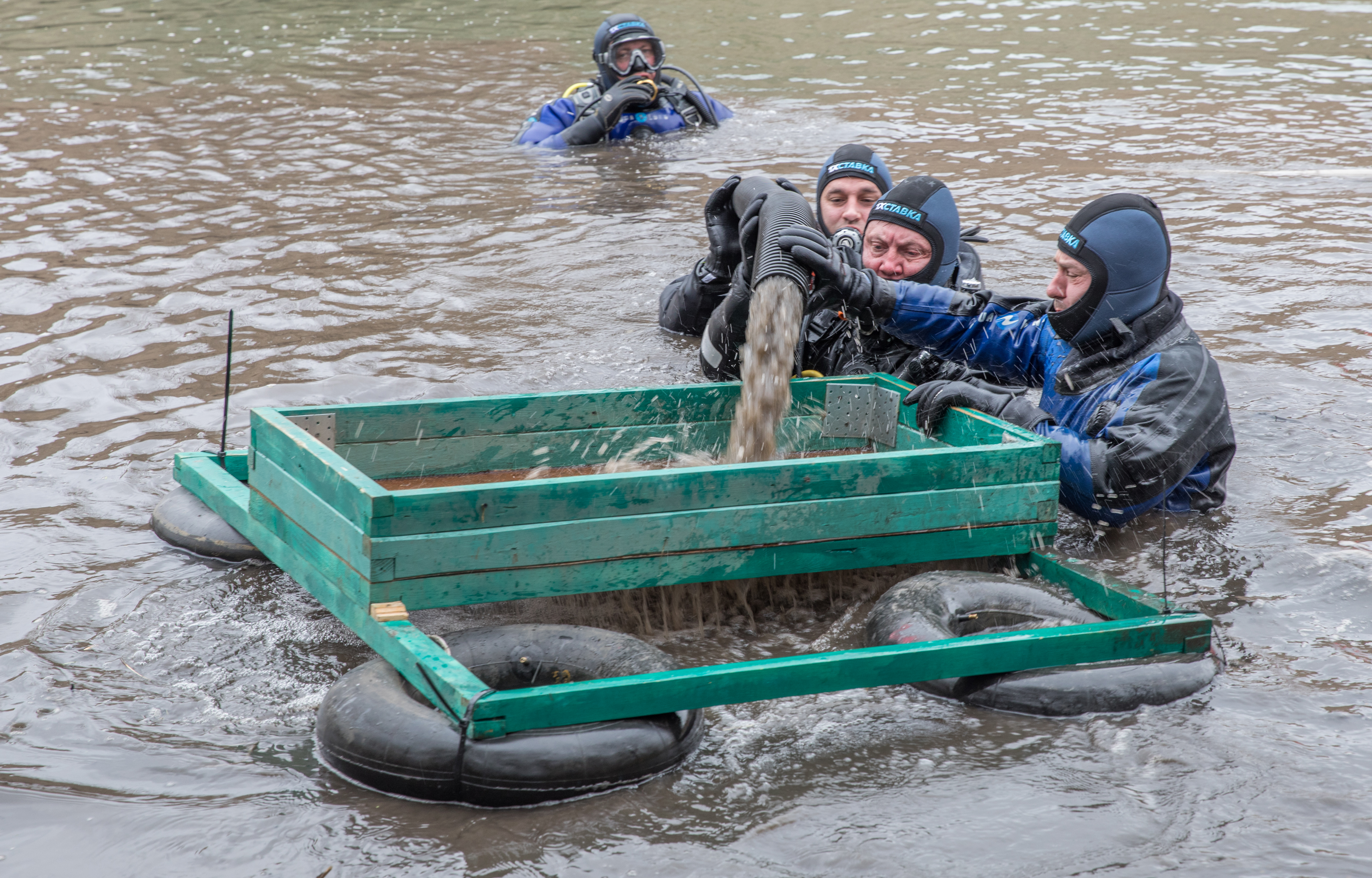 Divers dredge the sediments into a sifter. Photo by Stanislav Trofimov