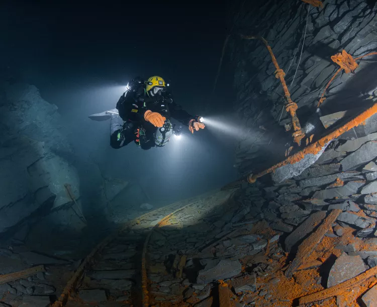 Pipes and rails run through the mine. Photo by Kurt Storms.